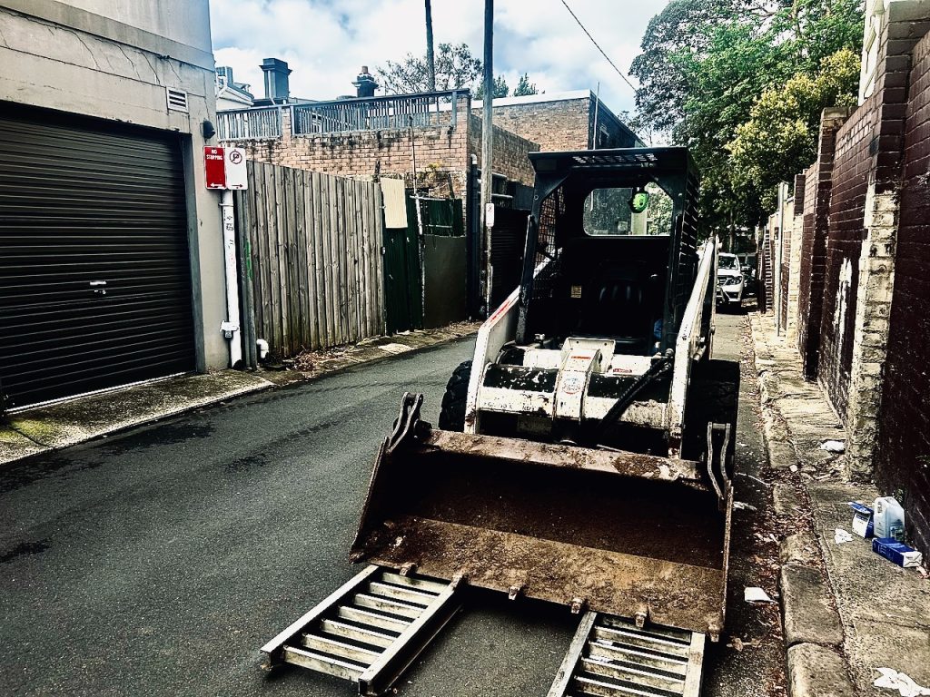 Remove a driveway with a bobcat